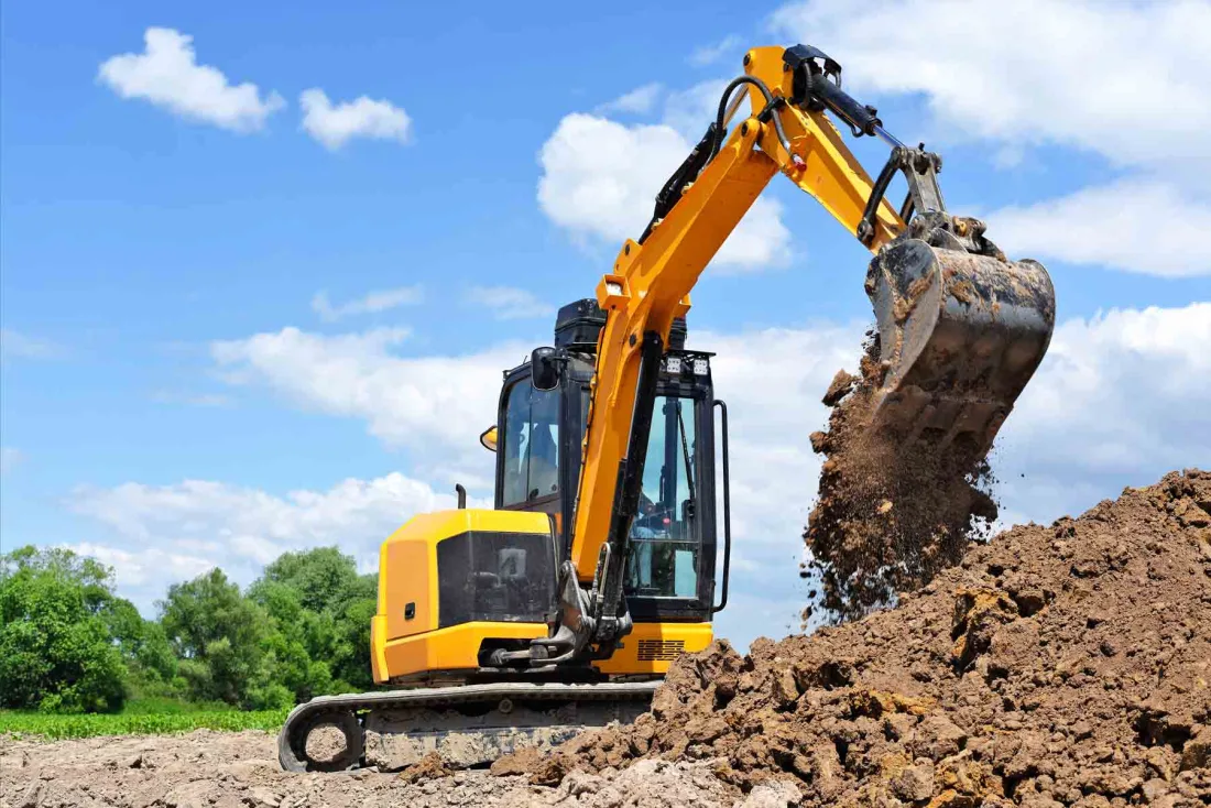 Excavator handling dirt work on a Spring, TX property